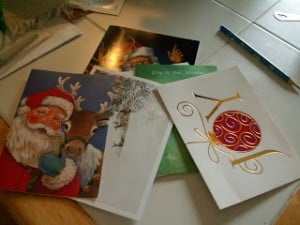 Learn to make tiny gift boxes out of last year's greeting cards