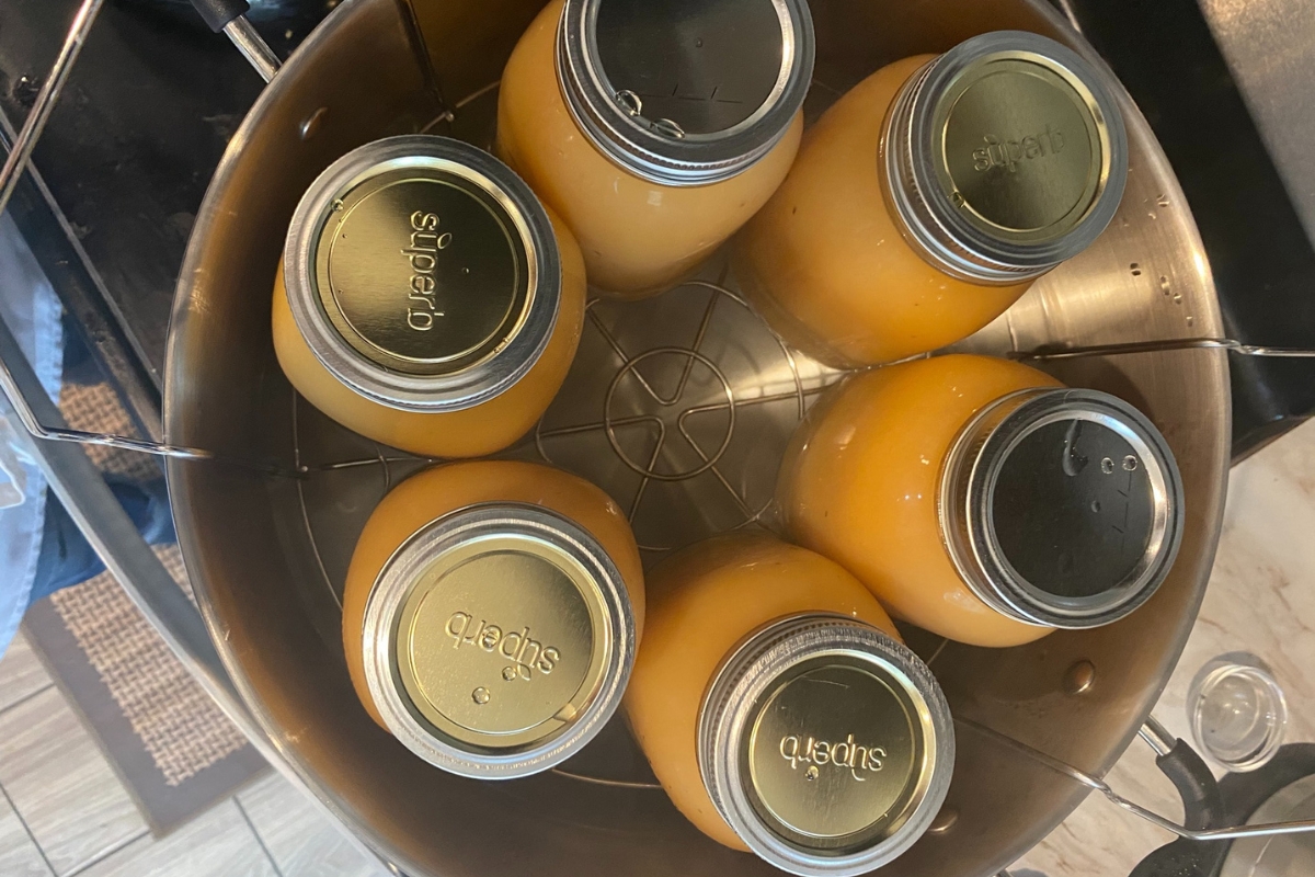 jars of applesauce in a canner