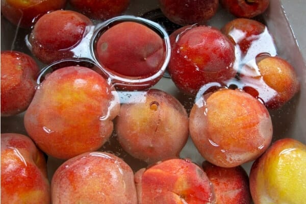 canning peaches- washing peaches