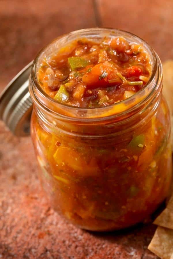 close up of open jar of home canned salsa with lid off