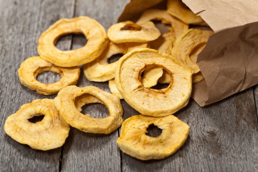 rings of dehydrated apples on a wooden table