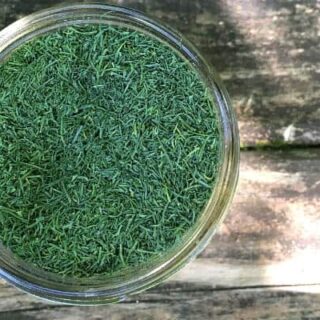 small mason jar filled with dried dill