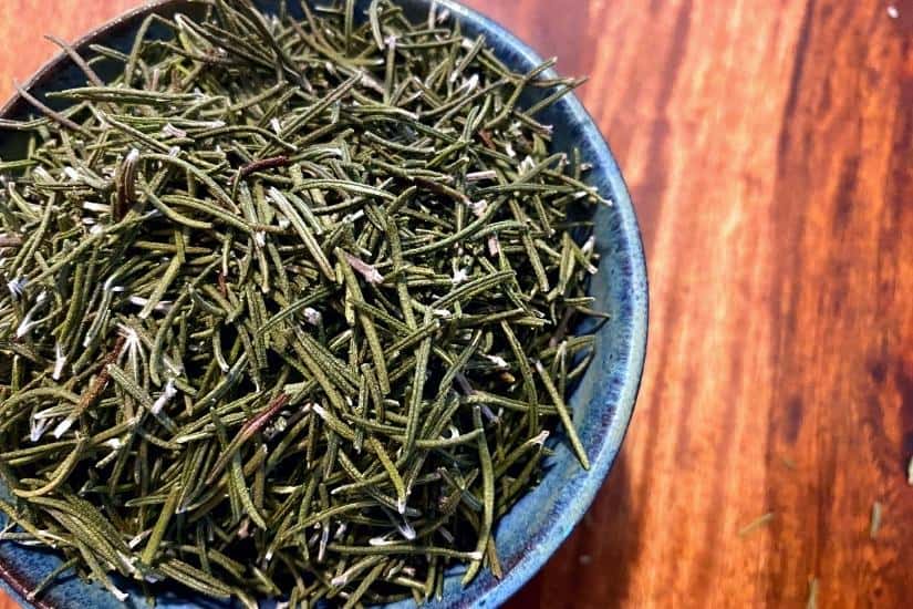 bowl of dried rosemary on a table