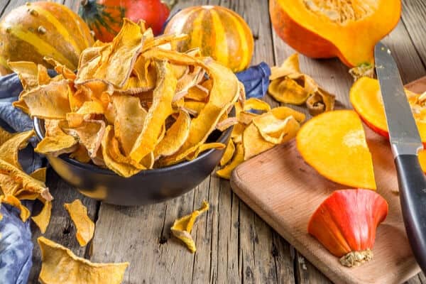 bowl of dried squash chips and cut up winter squash