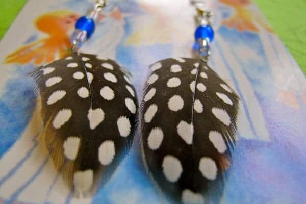 feather earrings with blue and clear beads