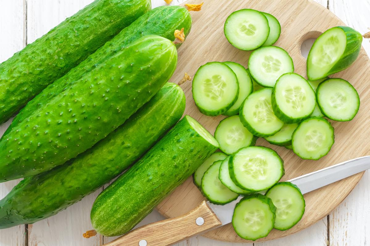 fresh cucumbers on cutting board