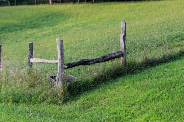 corner posts of a wooden fence properly braced and secured