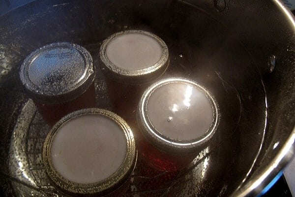 jars of redbud jelly in a water bath canner