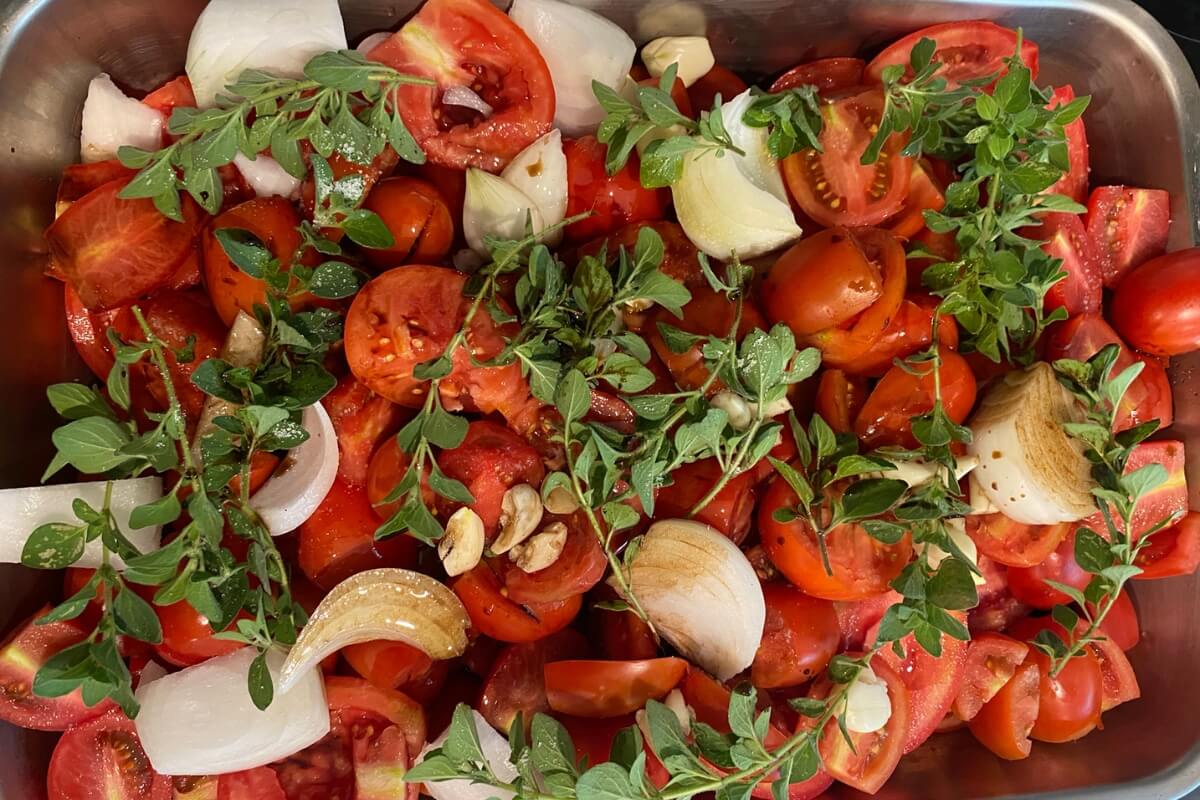 roasted tomato sauce ready to go in oven- tomatoes, onion, garlic, oregano