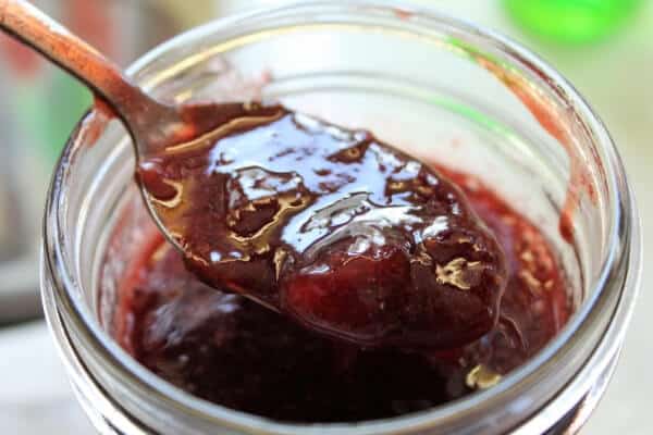 homemade strawberry preserves on spoon