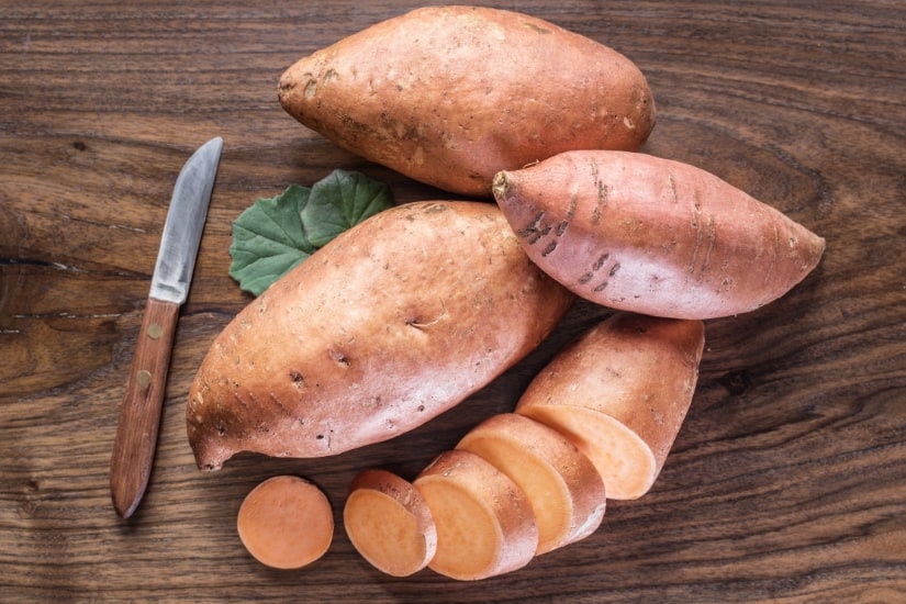 sweet potatoes on cutting board