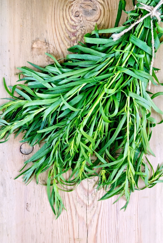 tarragon on cutting board