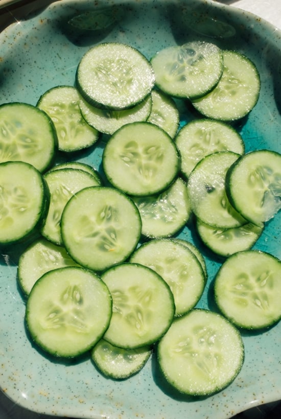 thinly sliced cucumbers on plate