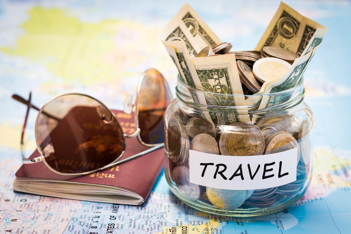 jar of money with TRAVEL label